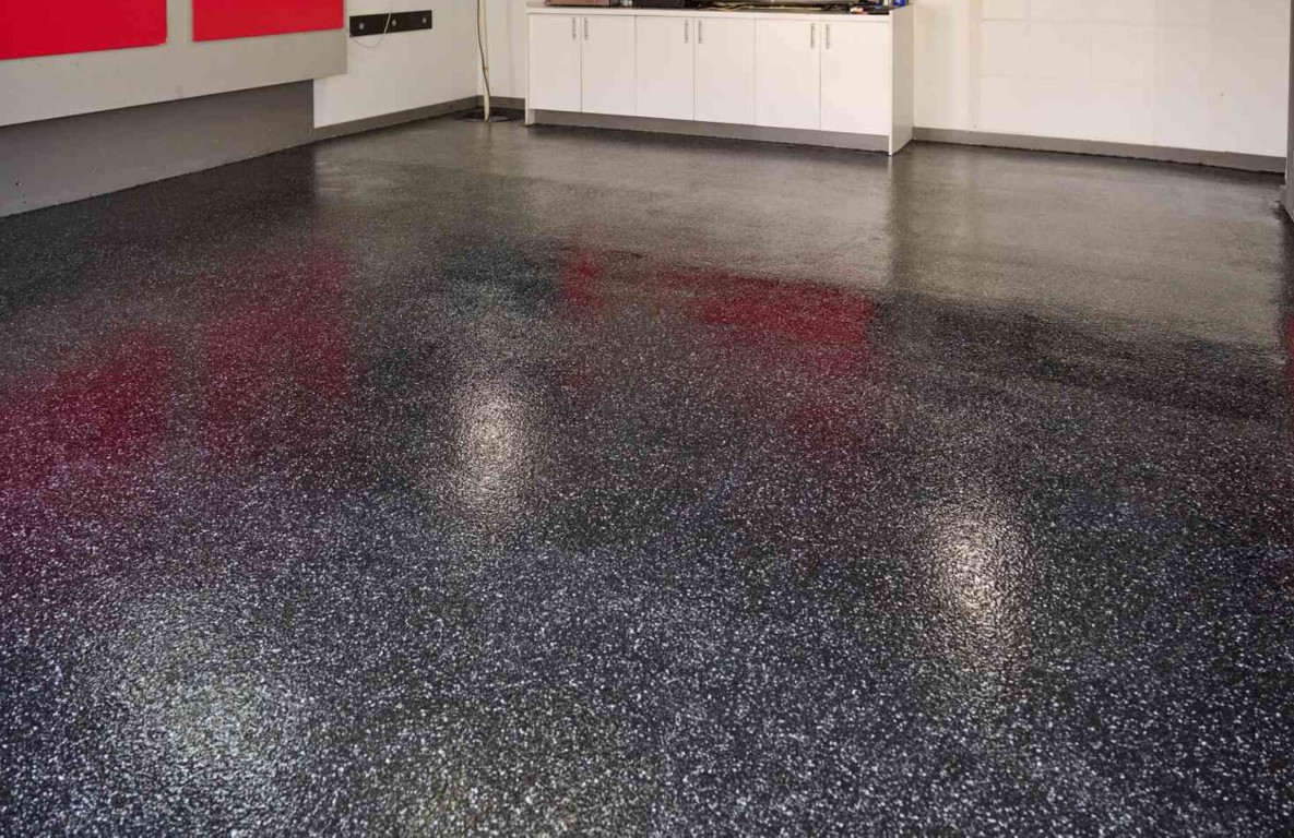 Epoxy coated garage floor with metallic finish in a residential garage
